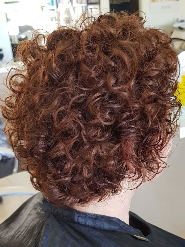 Girl with short tick curly hair